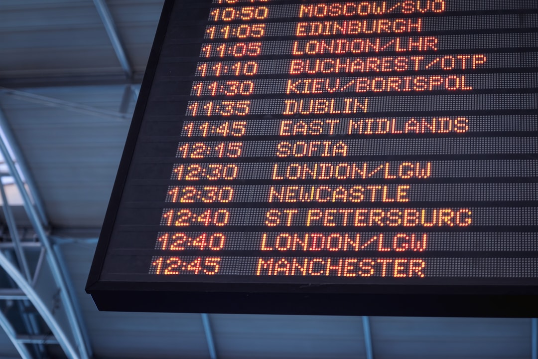 Traveler reviewing an airport departure board